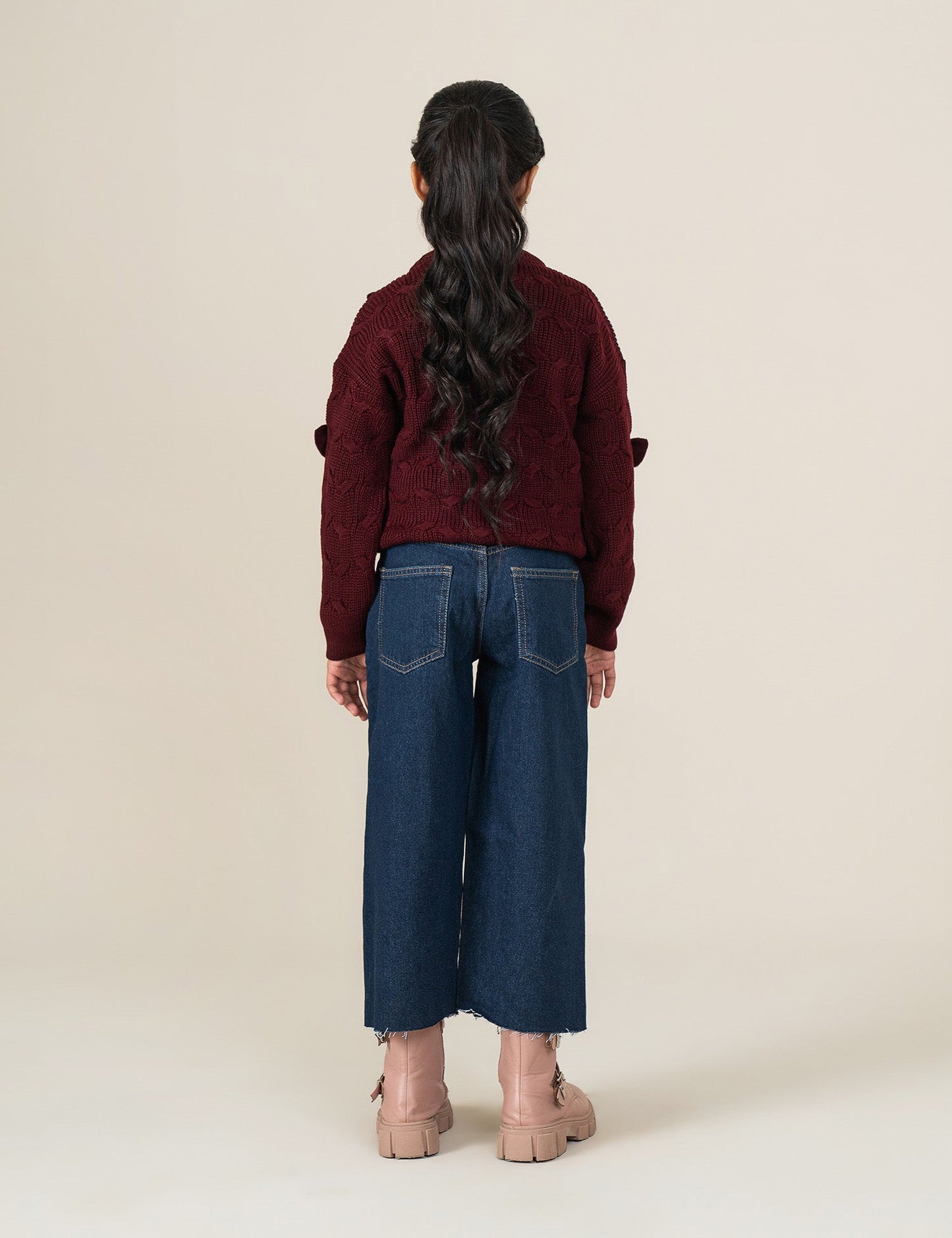 KNITTED SWEATER WITH BOW ACCENTS